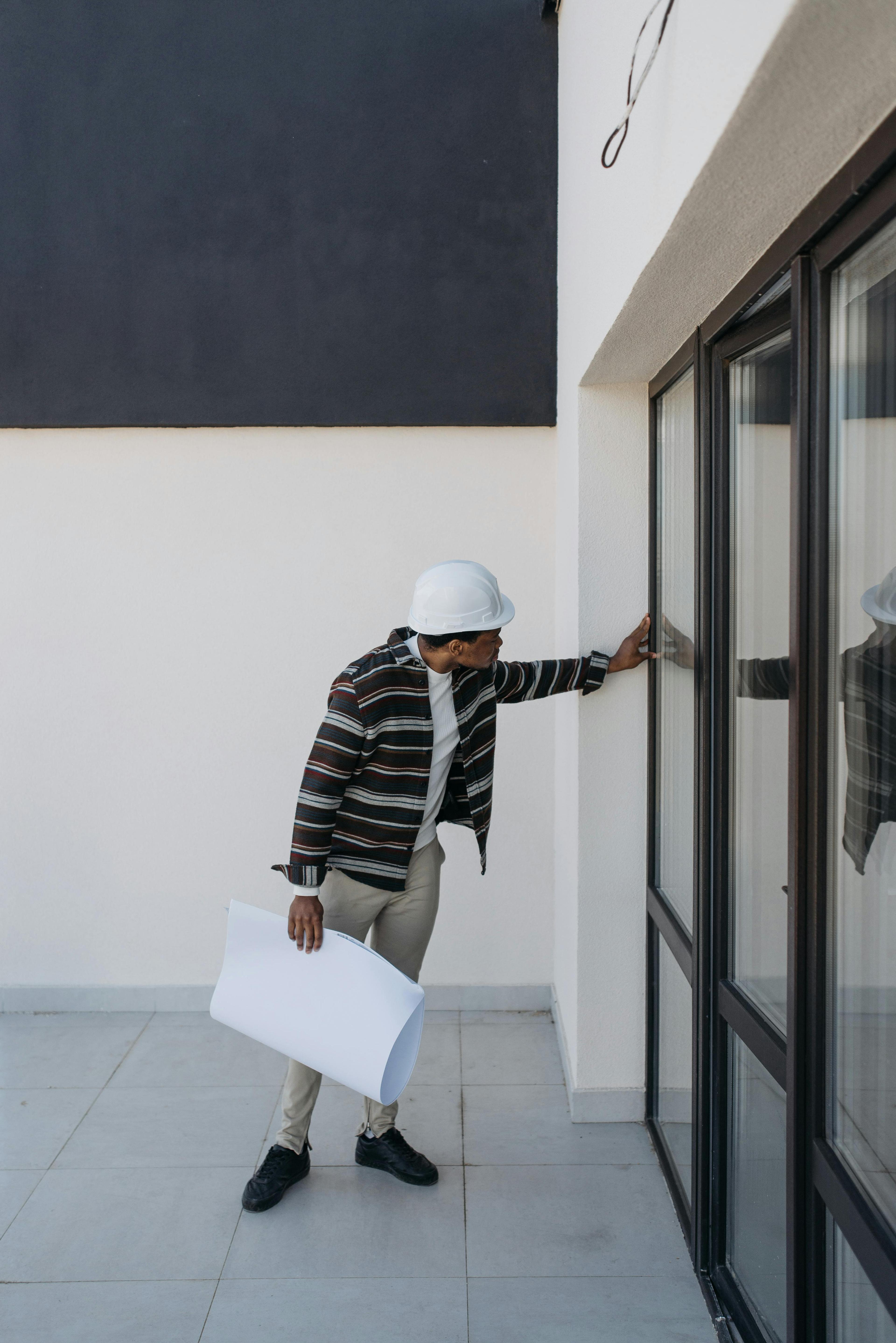 A builder inspecting a home during construction
